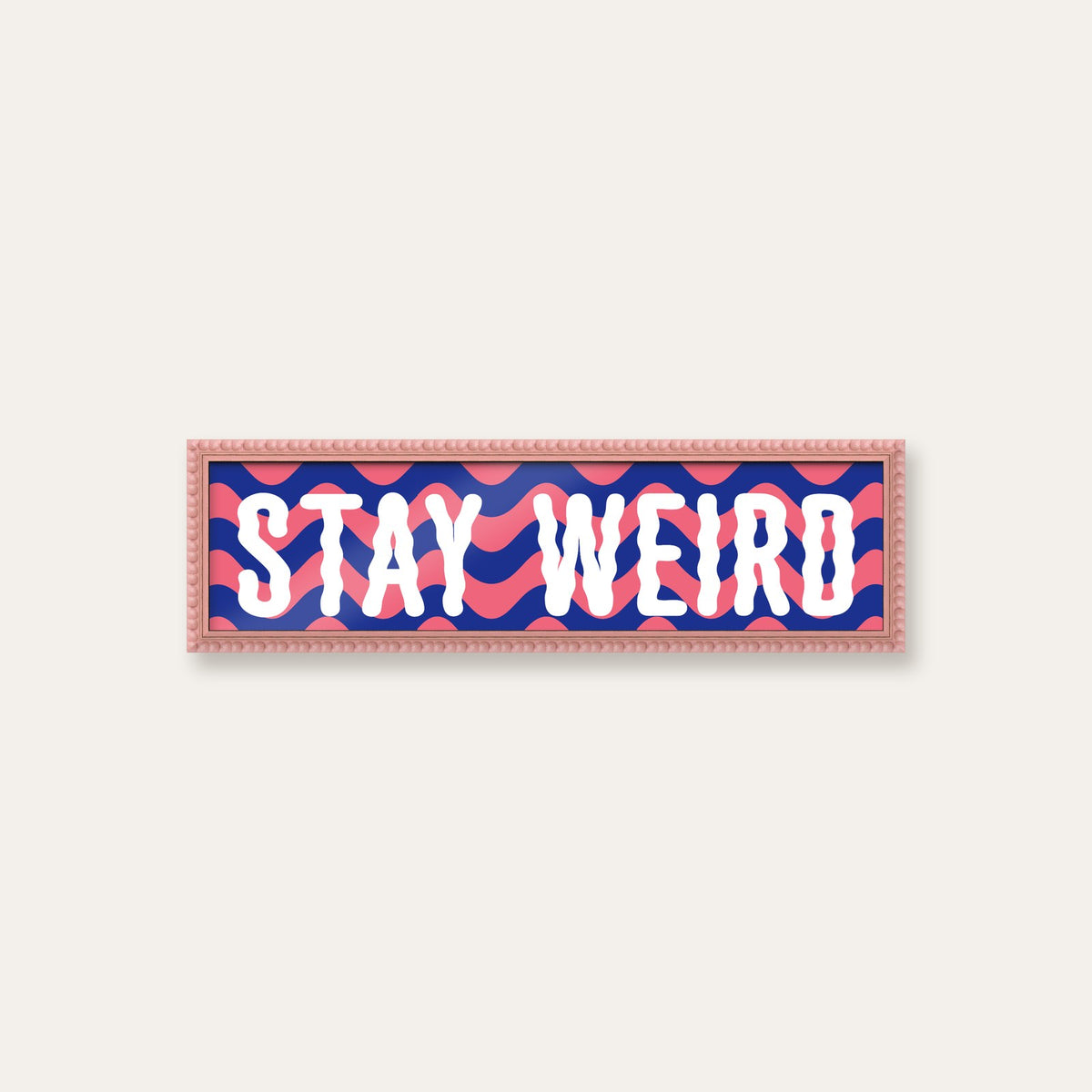 Stay Weird panoramic print in a pink bobbin frame