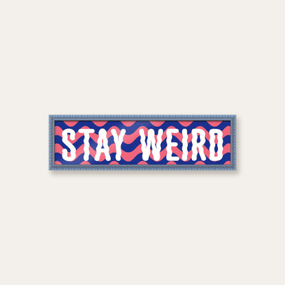 Stay Weird panoramic print in a sky blue bobbin frame