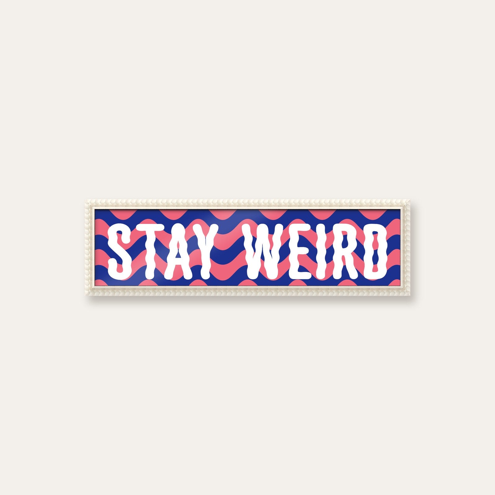 Stay Weird panoramic print in a white bobbin frame