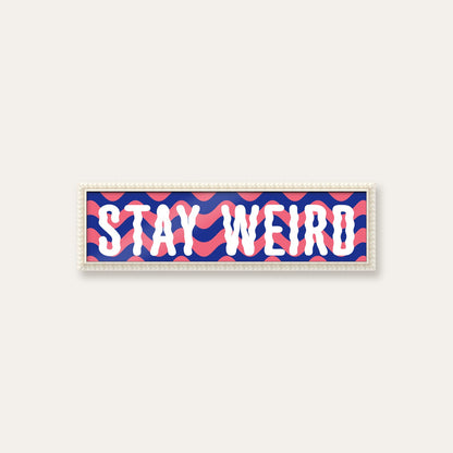 Stay Weird panoramic print in a white bobbin frame