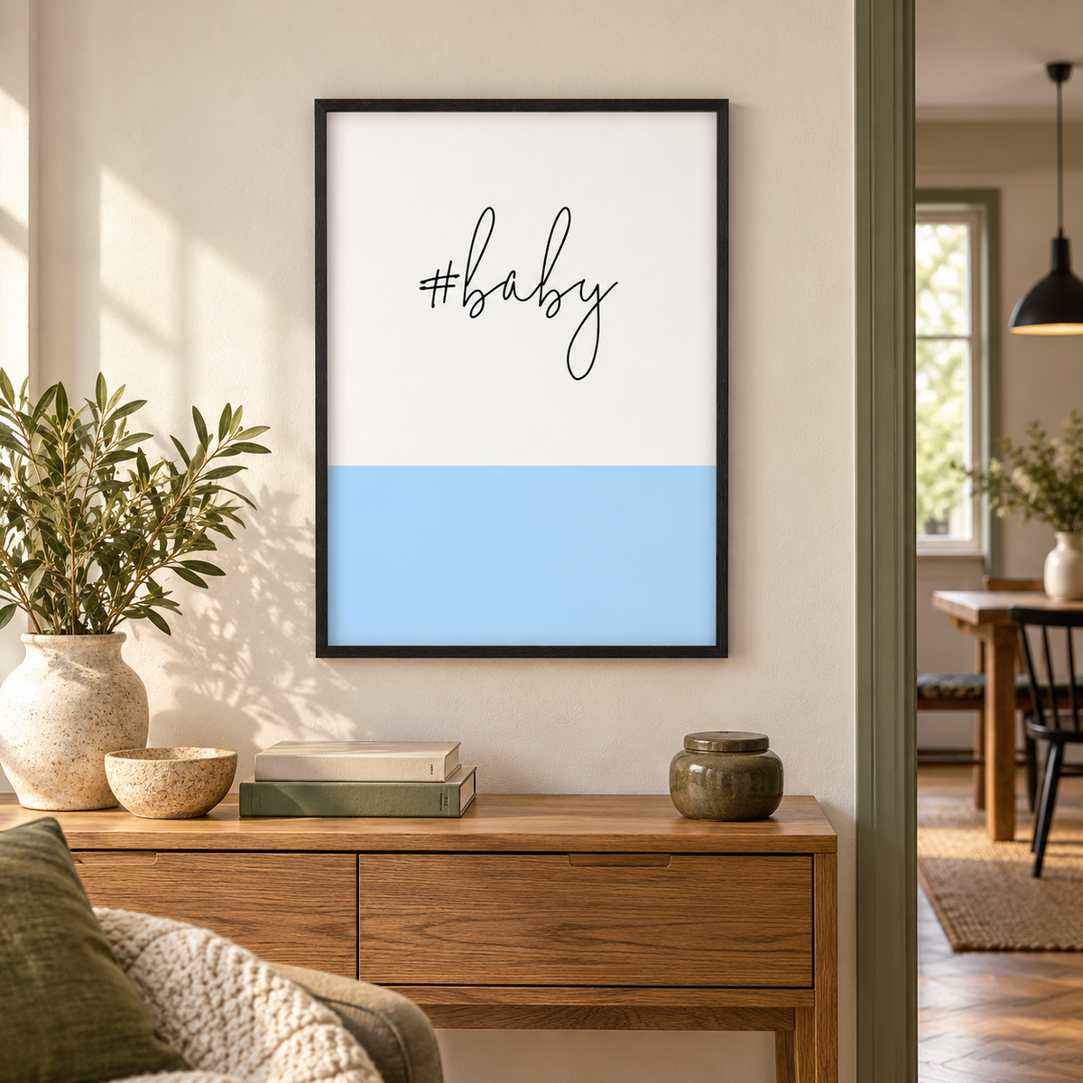 Hashtag Baby Print — wider room setting, black oak frame
